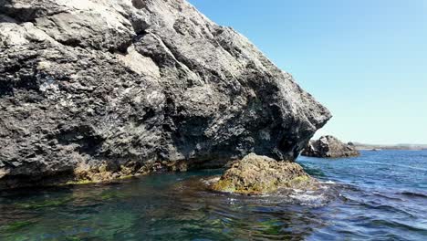 A-rocky-coastline-in-Sudak,-Crimea,-Russia-on-a-sunny-day