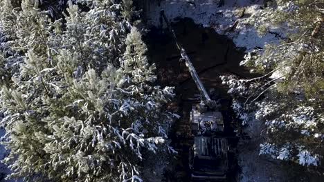 snow-covered forest road and vehicle recovery