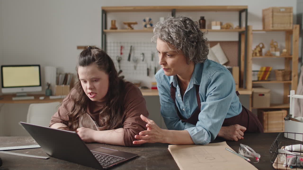 Woman with Down Syndrome Learning Craft with Teacher