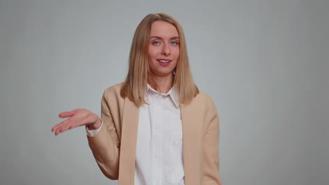 business woman pointing at camera and showing stupid gesture, blaming some idiot for insane plan