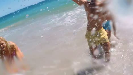 group of friends playing in water