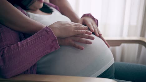 pregnant couple feels love and relax at home.