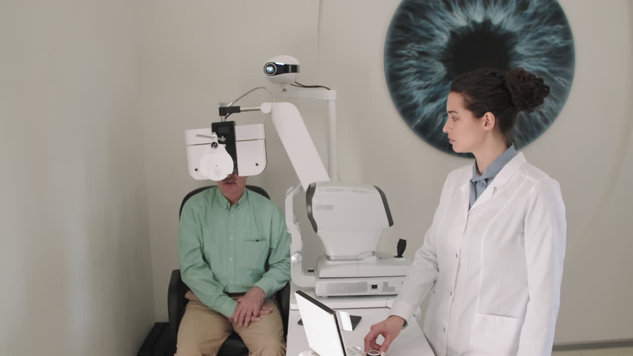 Optometrist Using Eye Chart Projector For Checkup