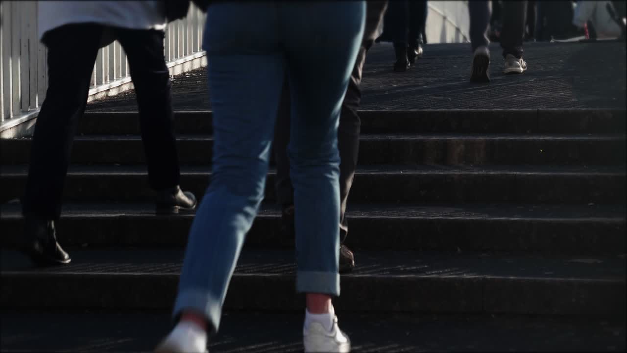 People Walking Up Outdoor Stairs in an Urban Setting