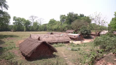 indigenous people in remote areas of india live in mud huts and thatched huts