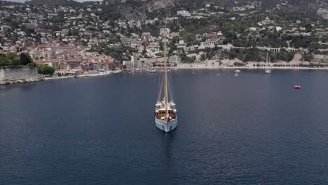 massive luxury yacht on mediterranean, france coastline - aerial orbit