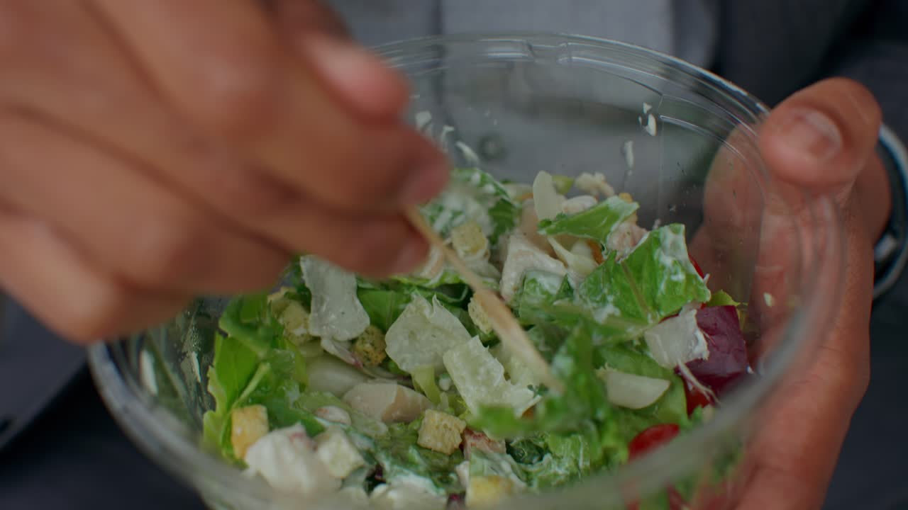 Close-up of a person holding a salad