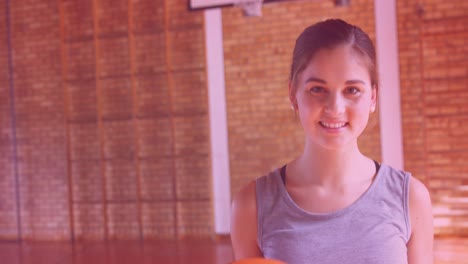 animation of girl power text over smiling girl with basketball ball