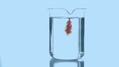 Animation-of-pink-shape-over-chemical-reagent-falling-into-glass-container