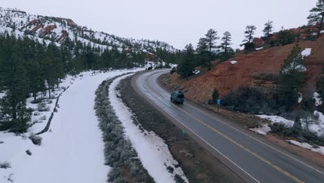 Following-A-Van-Driving-Through-The-Empty-Highway-Within-The-Bryce-Canyon-National-Park-In-Utah,-USA