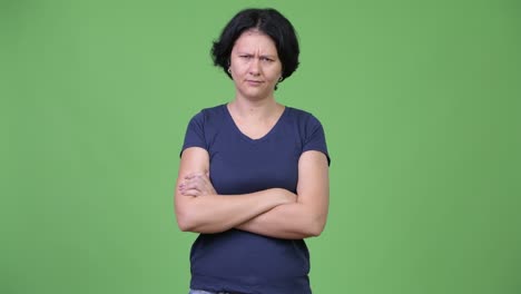 angry woman with short hair crossing arms