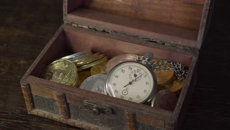 bitcoin and analogue metal stopwatch