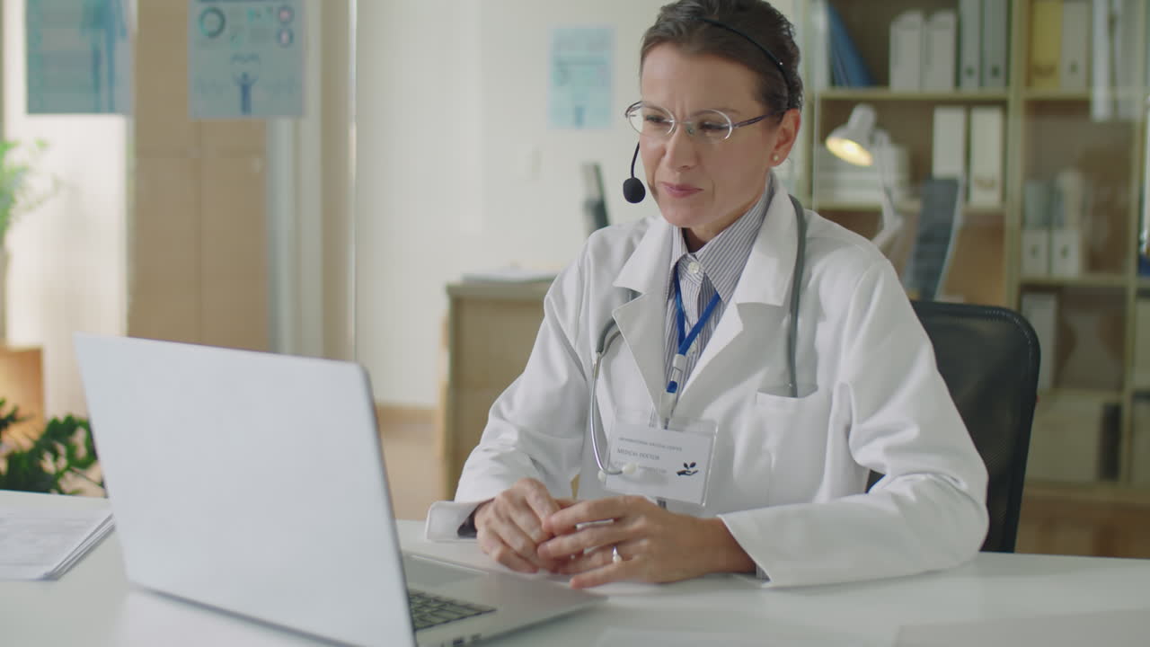 Female Doctor Consulting Online via Web Call on Laptop