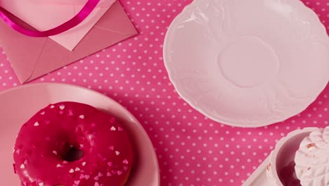 pink aesthetic tea party with donut