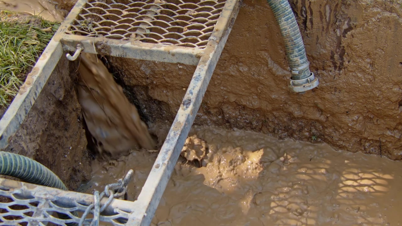 Drilling a water well to access underground resources in rural area