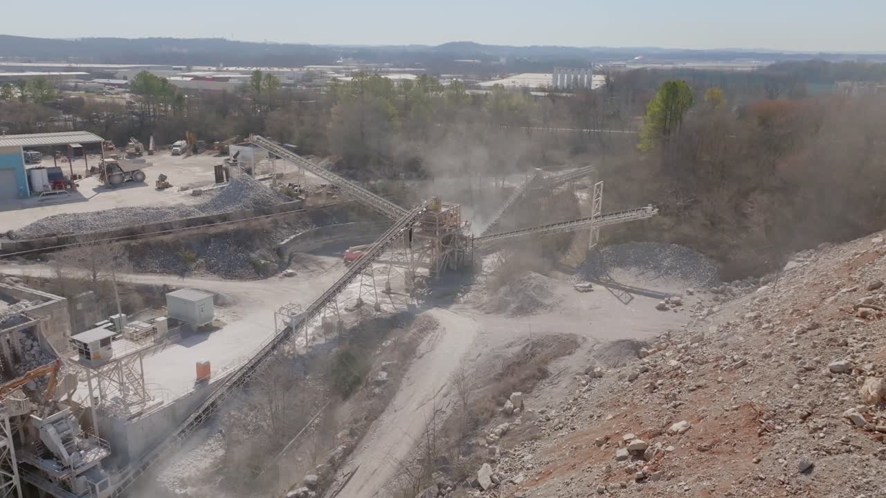Aerial footage of a bunch of conveyor belts moving rocks around.