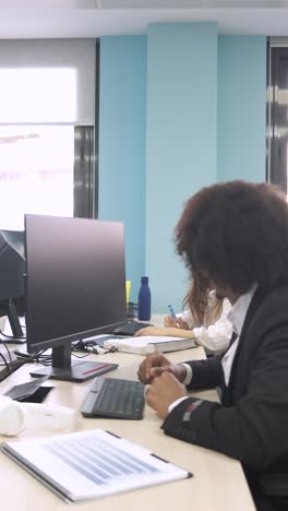 happy confident creative businessman using computer in office