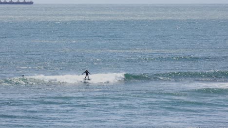 people in wetsuit surf water sport near shore, sea ocean water surfing