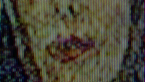 Pixels in the working old analog TV screen close up. Red, blue and green dot create the image on the screen. Macro. Close up