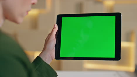 woman finger pointing chroma key tablet turning on online application close up.