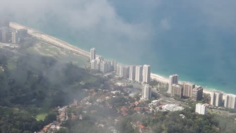 Foggy-View-Of-Modern-City-Buildings-In-Rio-de-Janeiro-By-The-Mountainside---aerial-shot