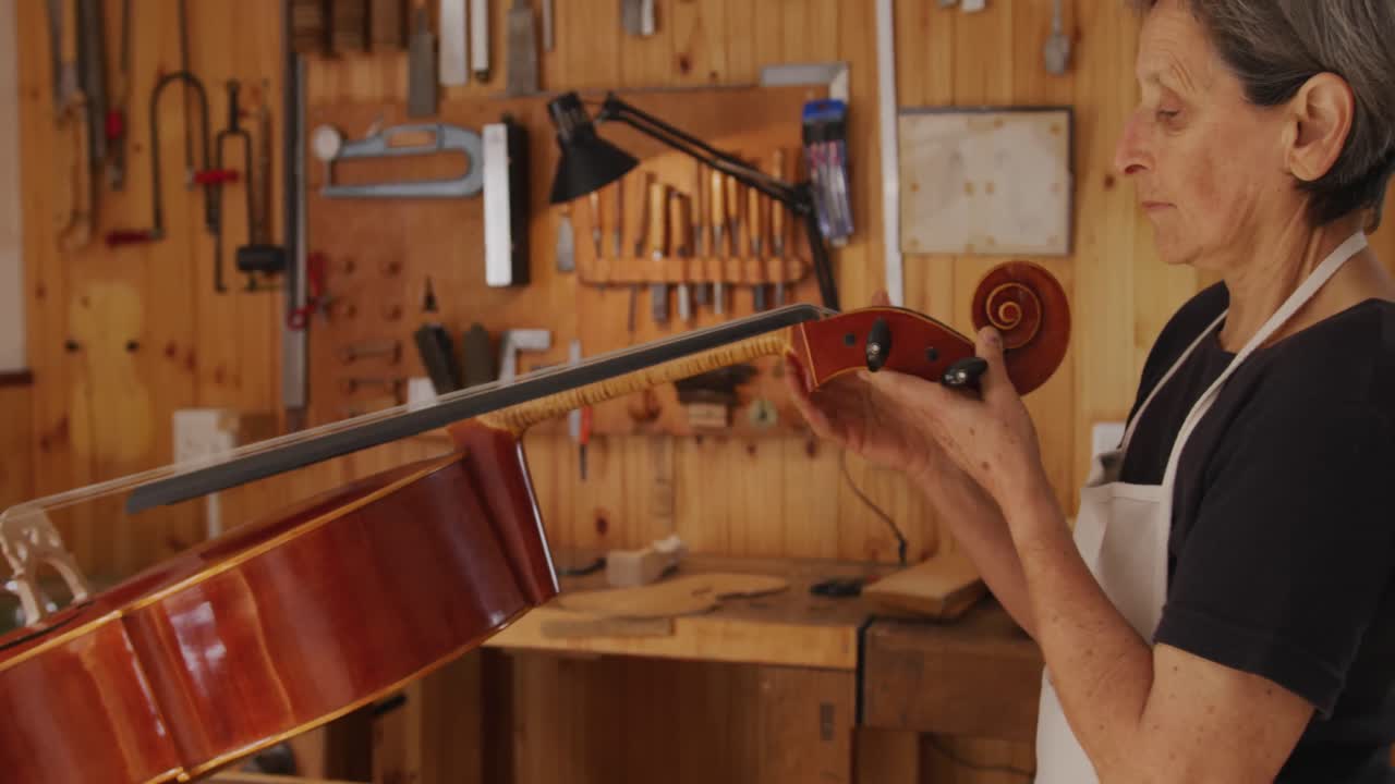 Female luthier at work in her workshop