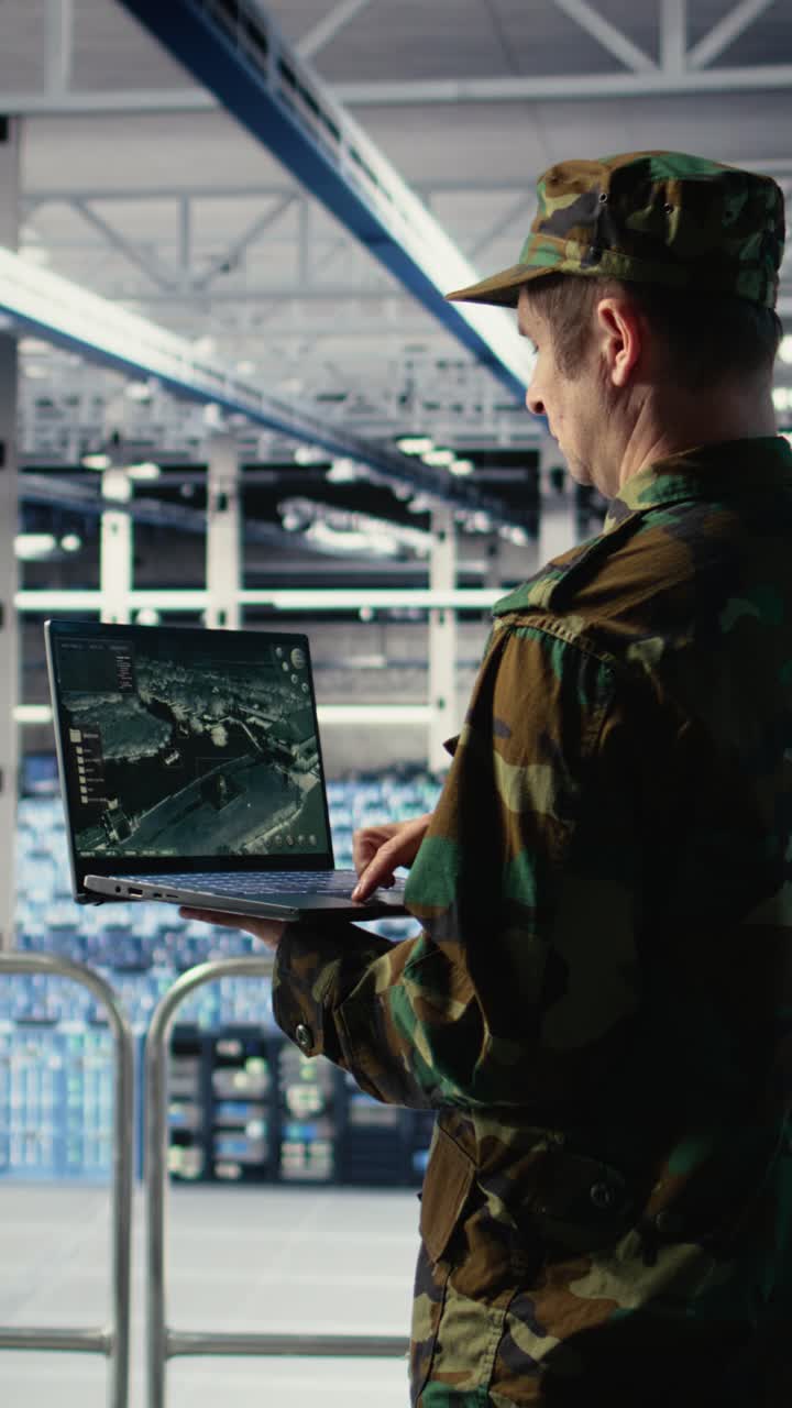 Vertical Video Military Engineer In Data Center Tracking Satellite Coordinates Using Laptop