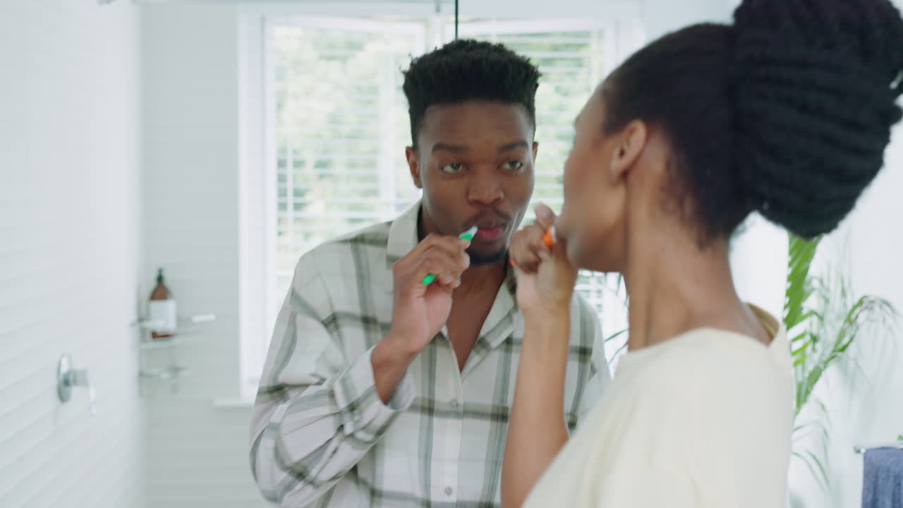 Dance, brushing teeth and black couple in bathroom
