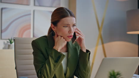 angry manager smartphone call in creative office closeup. nervous woman talking