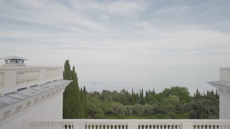 panoramic view from a balcony overlooking the sea and park