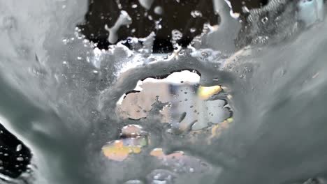 detail of a brush cleaning windshield in a car wash - view from inside the car