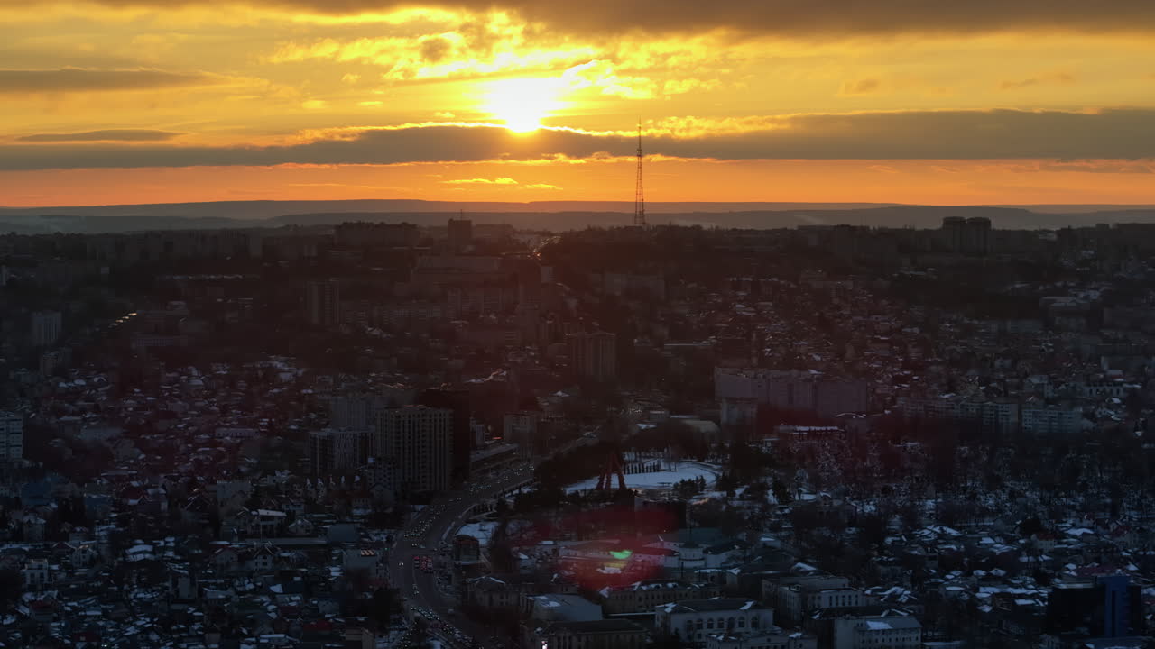 Aerial drone view of Chisinau city covered in snow at sunset. Winter in Moldova