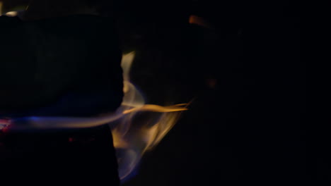 slow motion shot of flames and embers in a fireplace