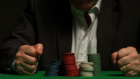 angry gambler slamming his hands on the table