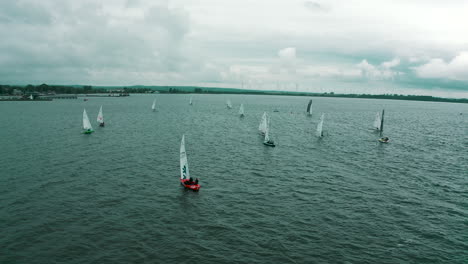 Aerial-view-of-drone-flying-around-yachts-that-race-in-regatta-on-Baltic-Sea-near-Puck-city-in-Poland