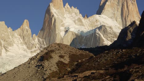 snow-capped peaks of mount fitz roy in patagonia against a clear blue sky, close-up