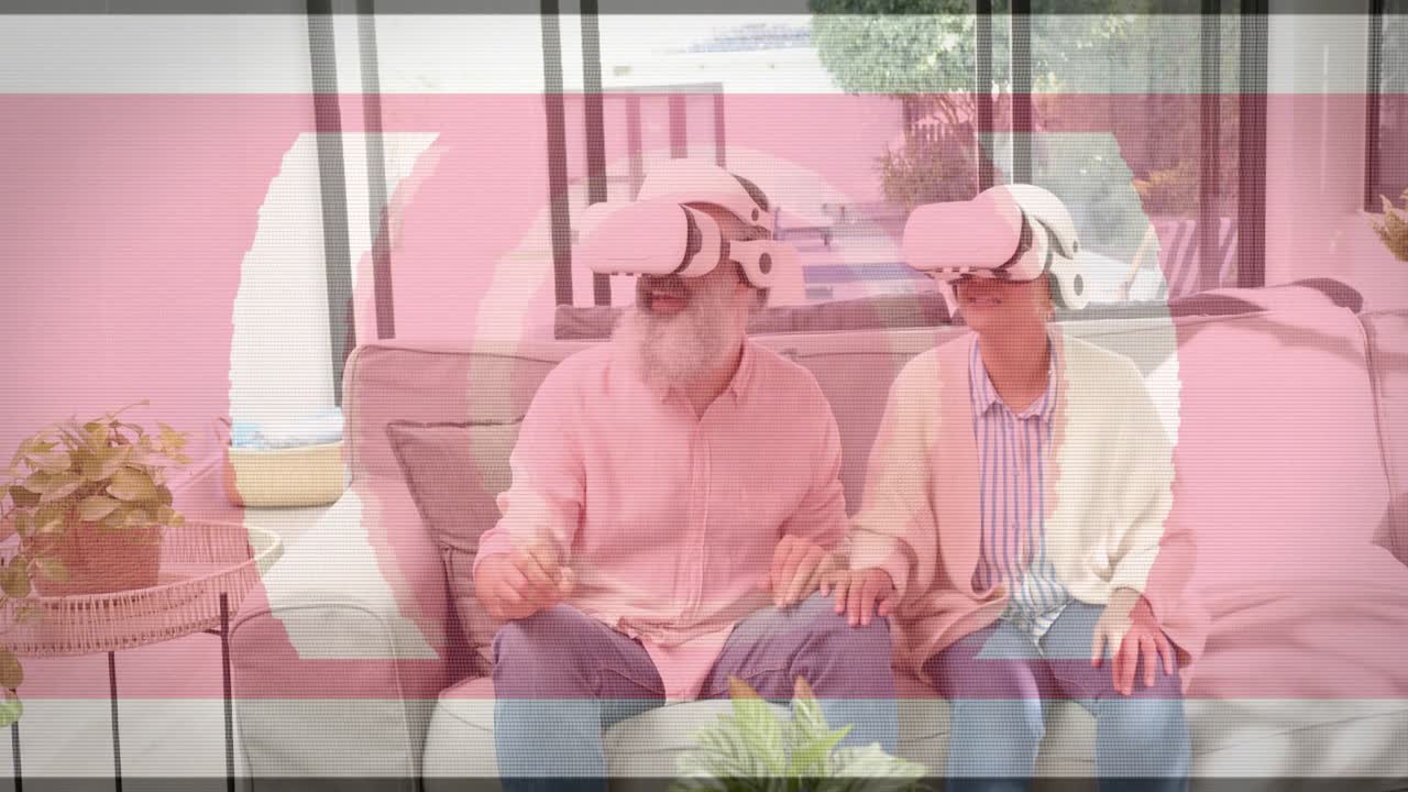 Mature duo on sofa, tracking HUD rings appearing as glitch bands overlaying while exploring VR tech