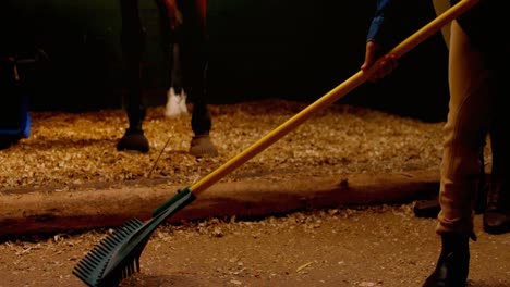 mother and daughter cleaning stable 4k