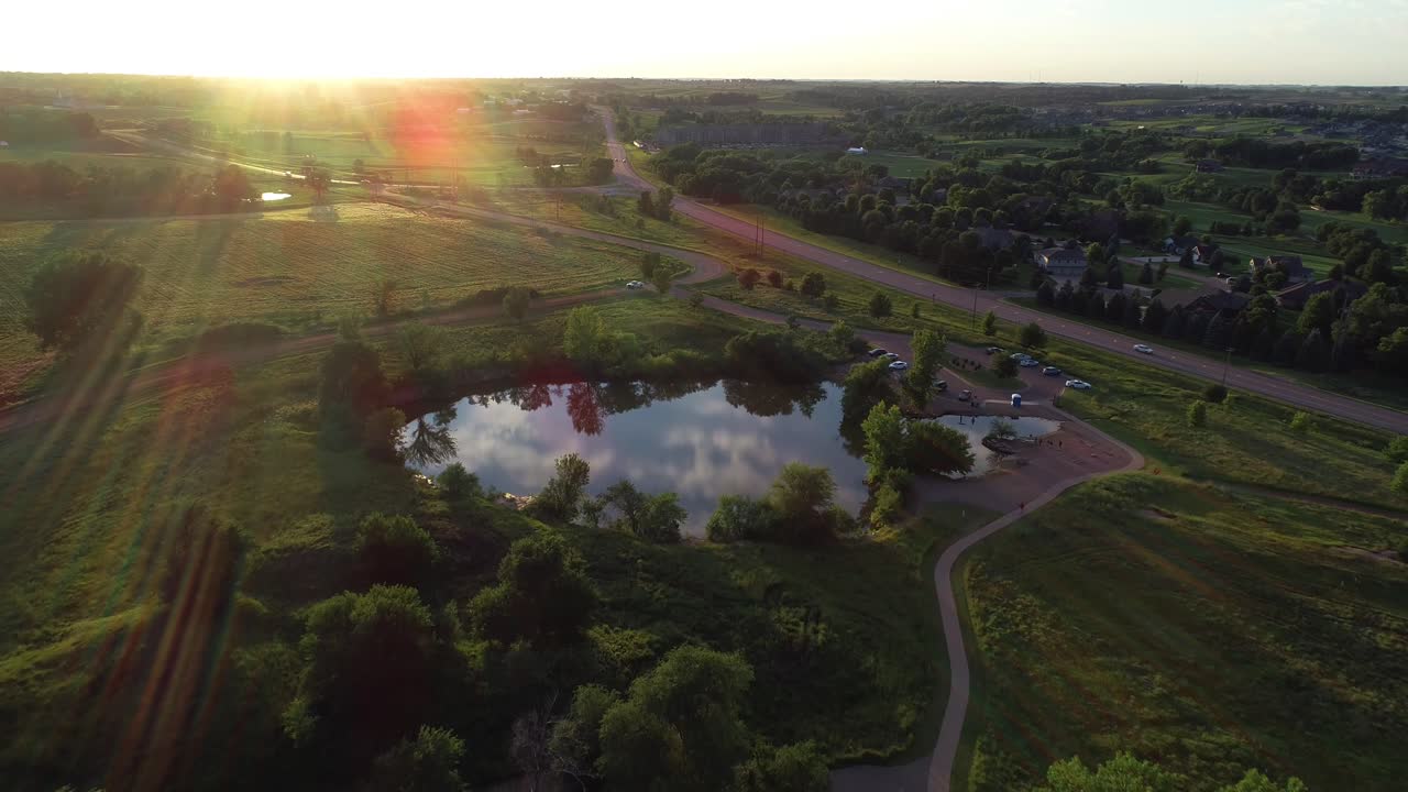 Aerial shot over water during sunset
