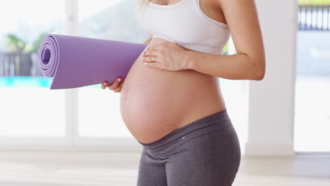 Fitness,-yoga-and-stomach-of-pregnant-woman