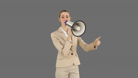 Positive-businesswoman-shouting-through-megaphone