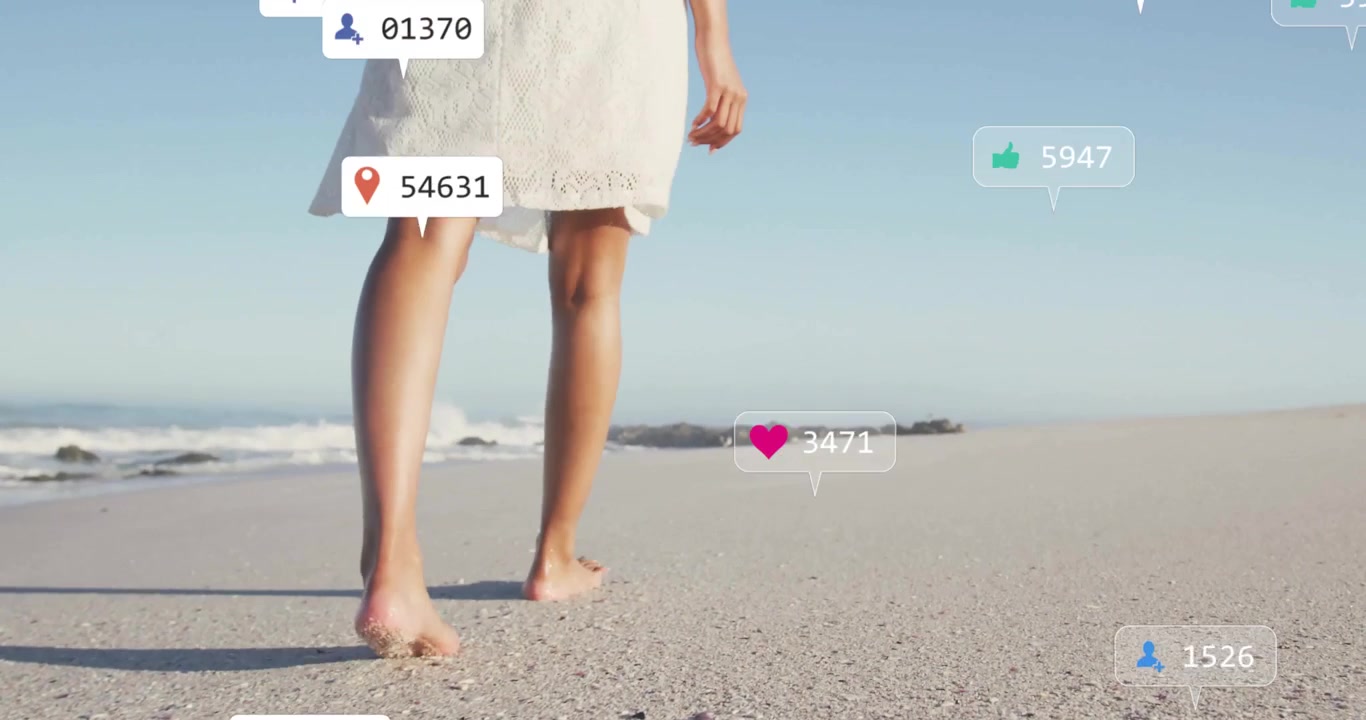 Barefoot woman walking shoreline activating floating engagement icons fluctuating online engagement