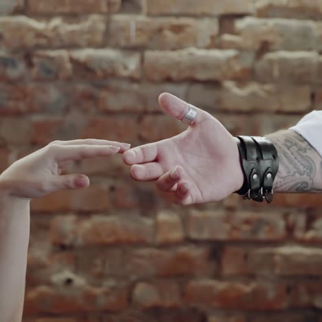 Couple touching hands