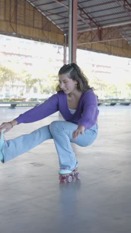 young woman roller skating and practicing skills in an urban environment