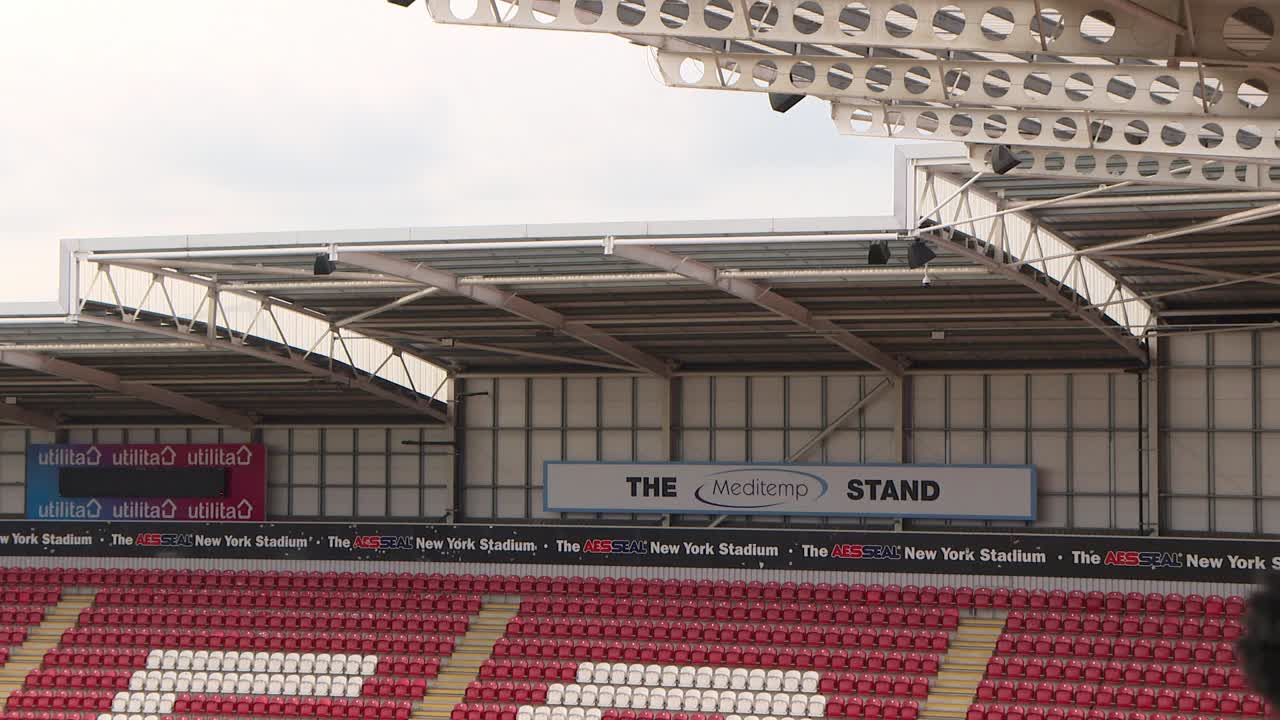Empty stadium seating area and stands with branding