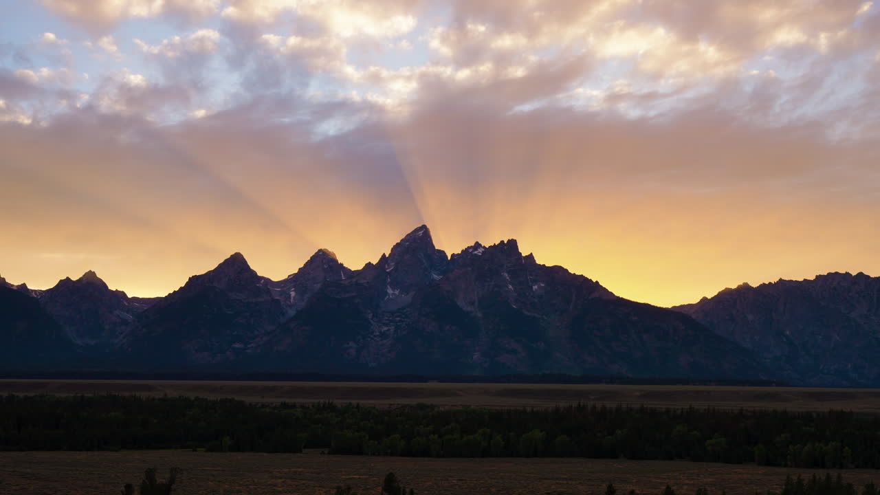 Sunrays over Grand Teton Mountains at Sunset