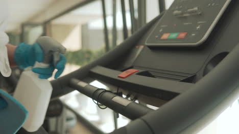 cleaning and disinfecting exercise machines in the gym