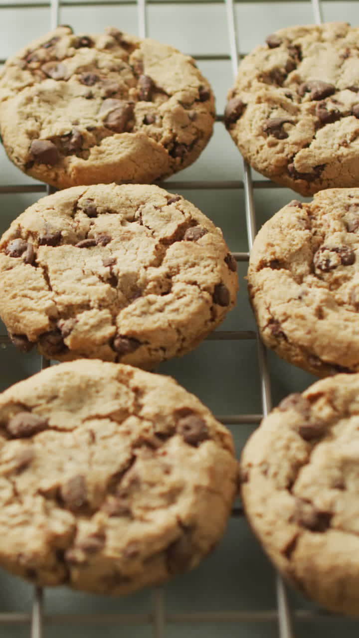 Video of rows biscuits on a baking rack over white background