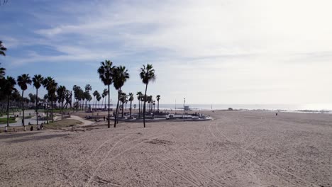 Drone-dollies-out-from-famous-skate-park-at-Venice-Beach,-California