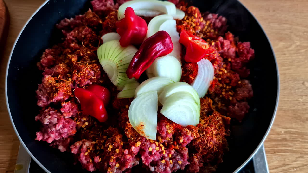 Cooking Ground Beef with Onions and Chili Peppers